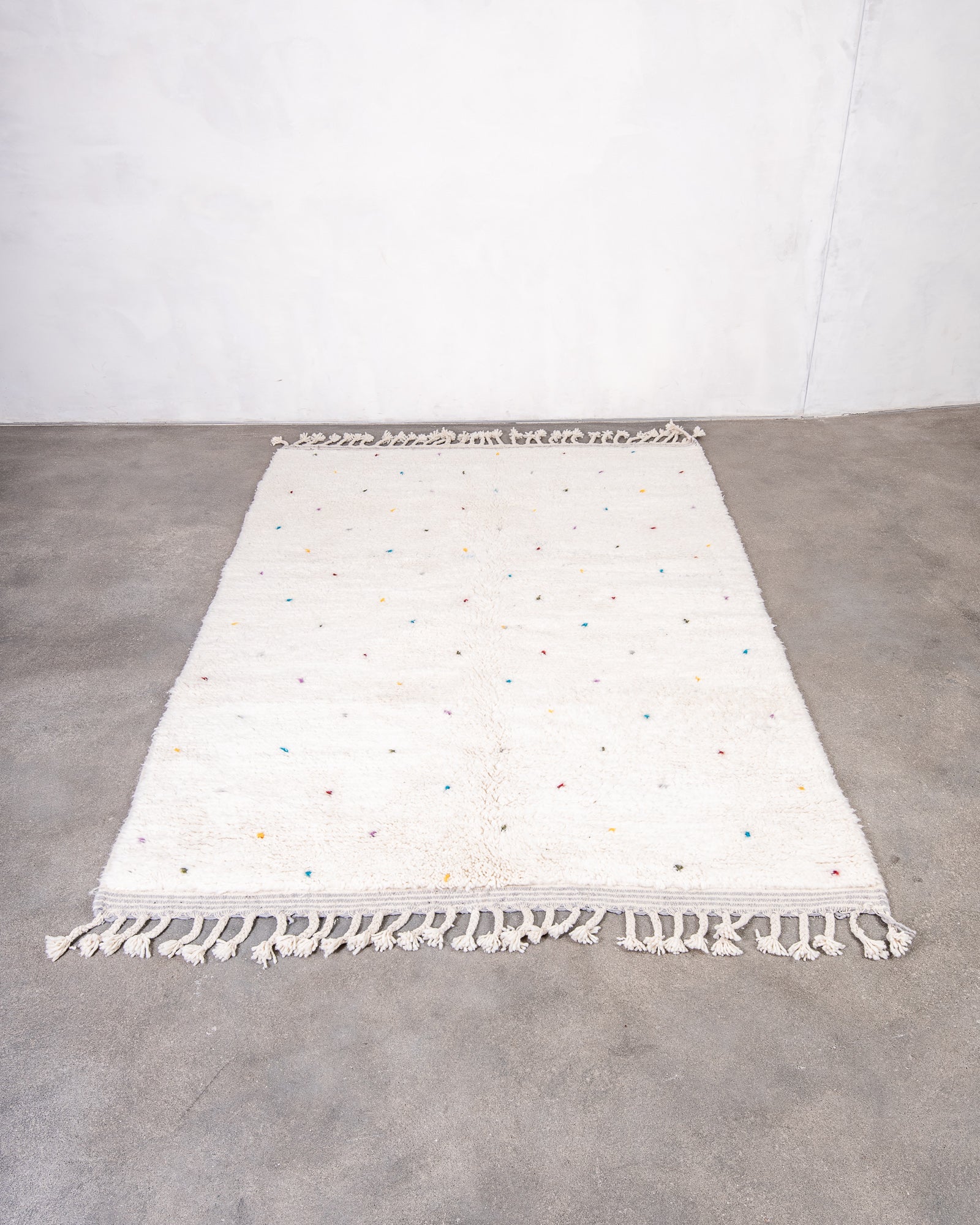 Modern, designer, handcrafted Berber rug from Morocco. Beniourain carpet with beautiful colours and patterns and fluffy wool texture.